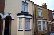 Two adjacent houses in Cambridge Street, 'improved' with painted bricks and stone cladding