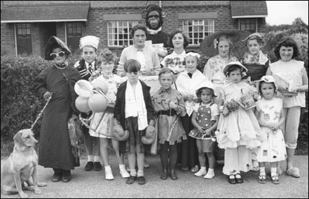 Castlethorpe 1959 fete - fancydress entries Back row:Tammy (dog), David Spinnelli, Gerald Pittam, Jane Bavington, (Monkey behind) Kenny Evans, Valerie Carpenter, Sally Cooper, Barbara Smith, Linda Spinnelli. Front row: Judith Grace, Norman Scripps, Pauline Webster, Brenda Garratt, unknown, Teresa. Stewart, Diane West