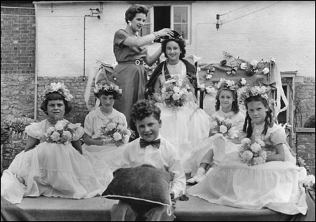 Dorothy Belton being crowned by Rosemary Ware, the attendants were Lynda Nicholls, Wendy Tipple, David Spinnelli, Yvonne Smith, Marlene Tapp