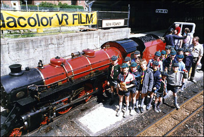 Cub Scouts standing by the miniture train at New Romney Station