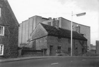 Almshouses, bridge with stone balustrade, Cinema behind