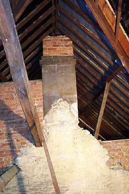 limestone wall, chimney and victorian rafters
