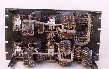 Rear view of a Repeater Panel. Wiring was carried out using cotton-covered enamelled copper wire. The output of the repeaters would not have been adjusted to give more than +10db. For example, with an input of -32db, and with the repeater set to maximum gain, the output would be +10db. High output levels would give cross-talk problems on the cables. 