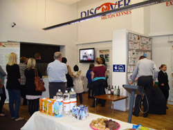 Project participants enjoy a film at the exhibition launch
