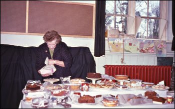 Mrs. Whiting, looking after the cake stall
