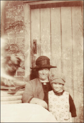 Caroline with her granddaughter Mary Pittam in 1927 outside the W Cottages