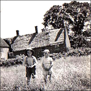 Roy with his cousin Maureen in the garden of the cottages at Bullington End