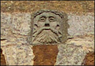 Stone head above the window