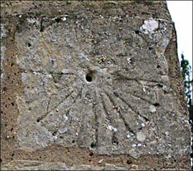 Mass dial on the west wall of the church.