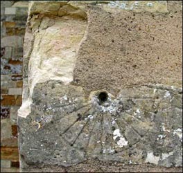 Mass dial on the south wall of the church.