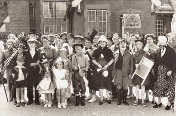 Some of the 48 entrants to Castlethorpe's fancy dress parade assembled on The Square before touring the village prior to the judging in the grounds of The Lodge