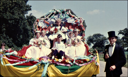 Parade marshal Tom West, with the  Queen and her attendants arriving at The Lodge.  