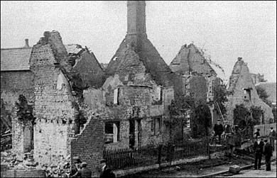 View burnt building in Front Street.