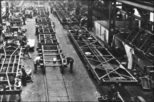 Wolverton Works - Men putting subframes on to bogies