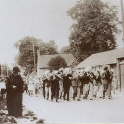 Hanslope Band marching along Gold Street past Tom Dickin's workshop c.1930