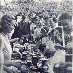 Tombola run by Mrs Jennings at the church fete on the vicarage lawn mid-1950s.