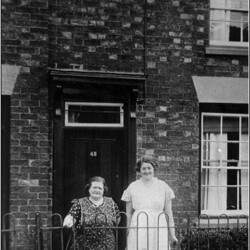 Mrs Horace Herbert and Kath outside 45 High Street.