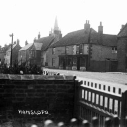 High Street with the Cock pub sign on the left, c.1920s
