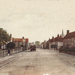 Belhams bus in the High Street outside the Cock c.1930