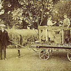 Robert and Dick Courtman as Blacksmiths on a parade float, July 1908.
