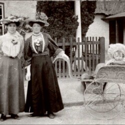 Ladies with a 'mail cart' pram in front of the old Cock in the High Street, c.1910