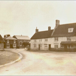 The Market Square, the Green Man and the old village pump. In the background is the Gospel chapel.