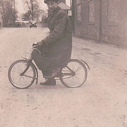 Jack Wesley, son of Fred, the wheelwright, outside the workshop in Castlethorpe Road.