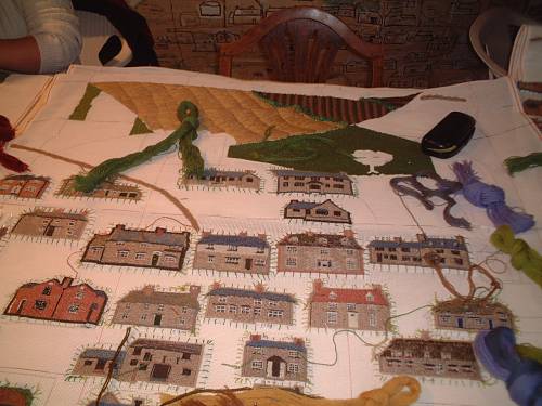 Houses stitched on the canvas
