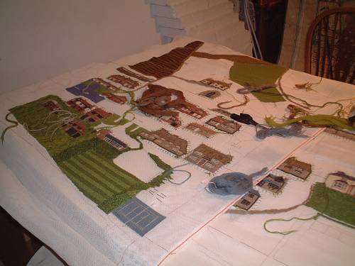 Houses stitched on the canvas