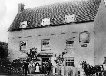 White Hart - believed to be about 1895 with Sally Lawes. Mr Bailey is standing by the trap
