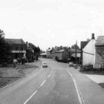High Street North looking south, 1960s. The entrance to Rogers Engineering is on the right, with The Knoll and Haynes Garage on the left. High Street North looking south, 1960s. The entrance to Rogers Engineering is on the right, with The Knoll and Haynes Garage on the left.