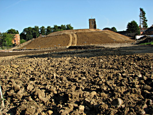 The mill and Church tower, but no trees, August 2009.