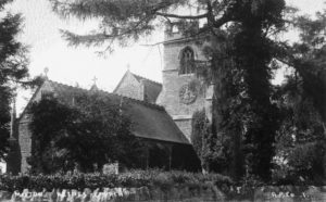 All Saints view from NW c1930 showing chimney of Victorian heating system in front of nave roof (to left of clock)