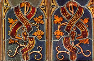 detail of stained glass above door in cloister
