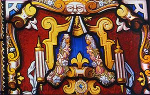 Grotesque issuing fruit and flowers from its mouth