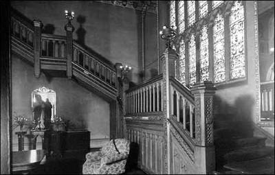 The stairs and armorial window.