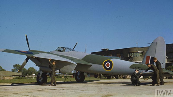Fitters making adjustments to the tailplane of Mosquito at Hatfield.